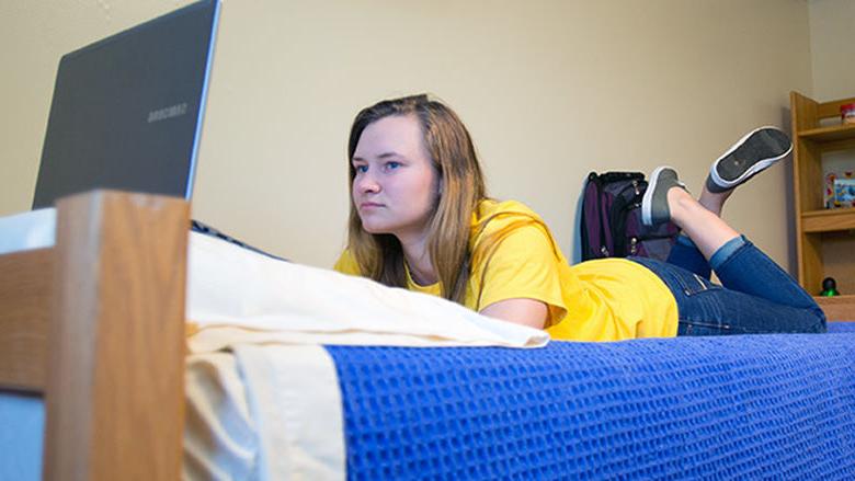 Student studying in her room.